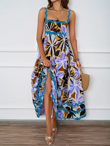 Detailed view of the summer vacation maxi dress featuring blue wavy trim and floral print