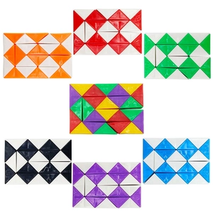 Macro display of seven 24-segment snake cubes in various colors on white background