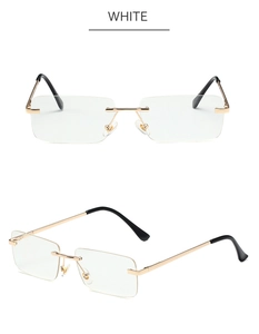 Detail of rimless rectangular metal frame with gold finish and transparent lenses