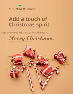 Detailed view of red and white candy cane, gift box, and train Christmas tree ornaments