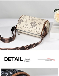 Detail view of cream Boston bag with leopard print and jacquard shoulder strap