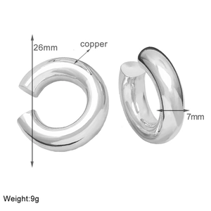 Detailed view of silver thick hoop clip-on earrings with size and material labels
