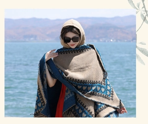 Ethnic style hooded shawl cape featuring heart patterns and fringe for outdoor travel