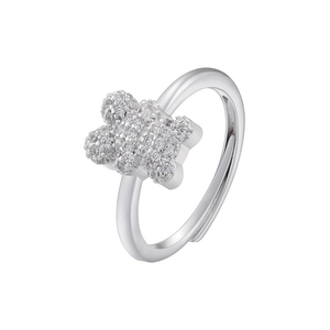 Macro shot of a silver teddy bear ring featuring micro-pave cubic zirconia on an open band