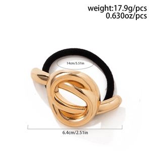 Detailed view of golden bow hair tie with dimensions 6.4cm length and 14cm inner diameter