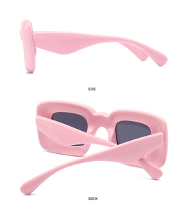 Side and back view details of pink chunky rectangle sunglasses with a futuristic design