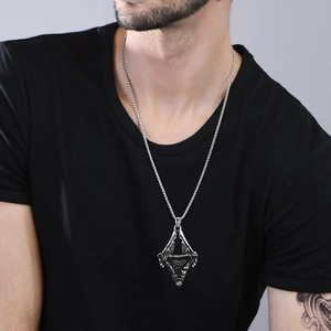 Close-up of vintage Eye of Horus pendant on silver stainless steel chain for men