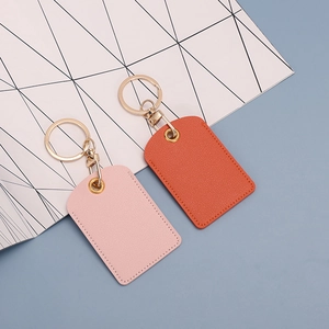 Cute leather key fob covers in pink and orange for access cards with metal rings