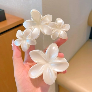 Elegant pearl white lily flower hair claw clips with glossy resin finish for styling
