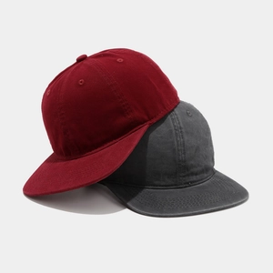 Washed cotton baseball caps in burgundy and dark grey, vintage hip-hop style headwear