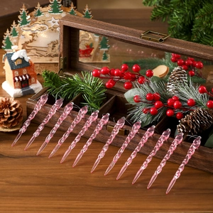 Set of 12 clear pink spiral icicle ornaments for Christmas tree decor in a rustic wood box