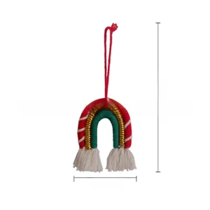 Macro view showing dimensions of a handmade woven rainbow Christmas tree hanging ornament