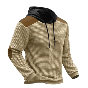 Detail of khaki waffle knit hoodie with black hood and brown elbow patches