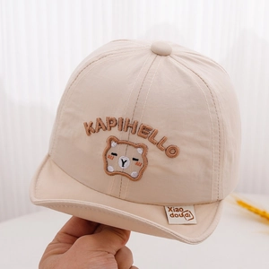 Detail of baby sun hat featuring cute bear embroidery and breathable cotton texture