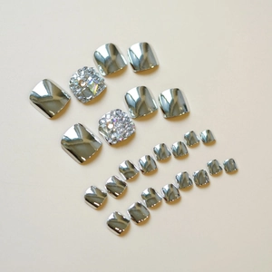 Silver mirror finish and rhinestone studded press-on toe nails set in various sizes