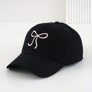 Detail of black cotton baseball cap with pink ribbon bow embroidery and eyelets