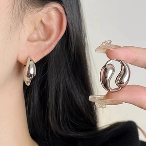 Polished silver teardrop hoop earrings for women with a sleek minimalist metal design