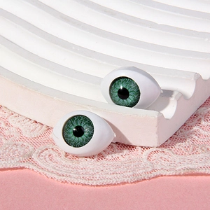 Pair of green 14x19mm acrylic doll eyes on pink lace and white wave base for toys