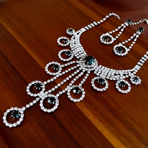 Macro detail of luxury fringe necklace with black stones and sparkling rhinestones