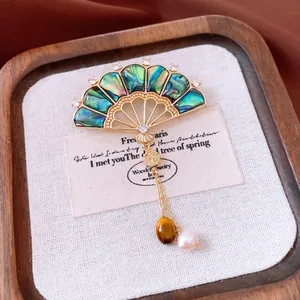 Vintage fan brooch with gold plating, abalone shell, tiger eye stone and pearl accents