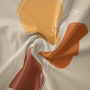 Close-up of bohemian wall tapestry showing soft beige fabric with abstract geometric patterns