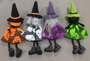 Detailed view of four handmade Halloween witch doll hanging ornaments in vibrant colors