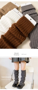Detail view of colorful ribbed knit leg warmers for girls in brown, white and grey colors