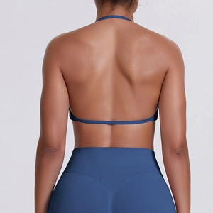 Detailed back view of seamless deep blue halter sports bra with crisscross strappy design