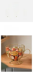 Detail of gold cup-shaped coffee pod holder made of iron wire with a Coffee badge