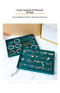 Detailed view of dark green velvet jewelry trays with 12 compartments for rings and earrings
