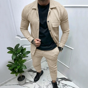 Close-up of beige men's two-piece set featuring textured vertical stripe jacquard fabric