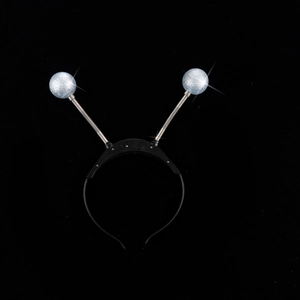 Detail of glowing alien antenna headband with blue sequin balls and spring coils