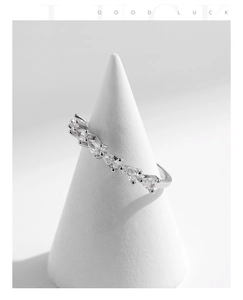 Macro detail of S925 silver ring featuring six teardrop shaped sparkling gemstones