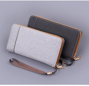 Détails de pochette en toile grise pour homme avec fermeture éclair et dragonne pratique