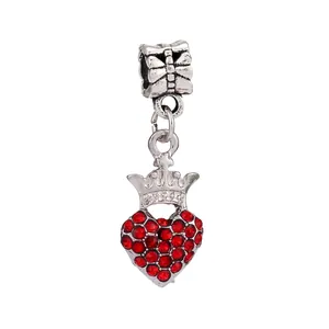 Detailed view of silver crown charm with sparkling red rhinestones for bracelets