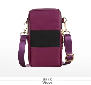 Detailed back view of purple nylon crossbody phone bag with adjustable strap and gold hardware