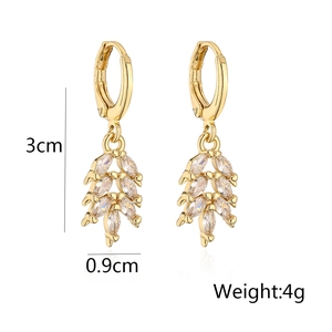 Macro shot showing 3cm length and 0.9cm width of gold earrings with marquise zircons