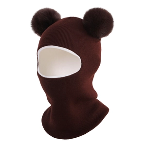 Detail of dark brown ribbed knit balaclava with dual faux fur pom-poms for toddlers