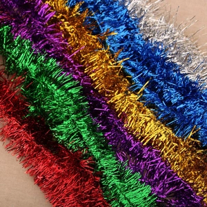 Close-up of colorful 180cm Christmas tinsel garlands with metallic glitter snowflakes