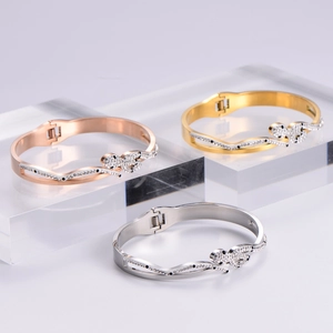 Elegant leopard head open bangle with crystal pavé in gold, silver, and rose gold finish