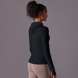 Detail of slim-fit hooded sports jacket with elastic fabric for yoga and running