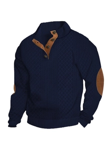 Detail of dark blue knit sweater showing elbow patches and brown buttoned collar
