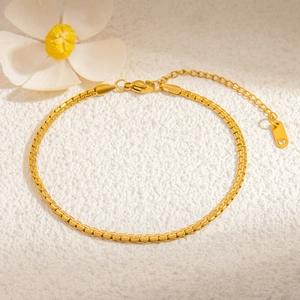 Close-up of an 18K gold-plated stainless steel box chain with an adjustable clasp