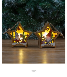 Pair of star-shaped wooden LED ornaments with gnome patterns and warm festive lighting