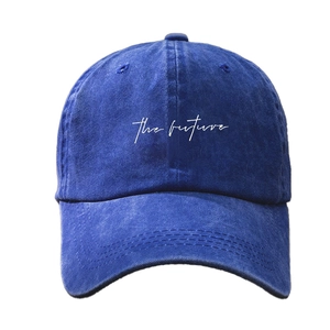 Classic navy blue washed denim baseball cap featuring white cursive The future embroidery