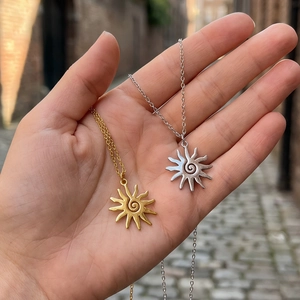 Spiral sun pendant necklace set in gold and silver finish with fine link chains