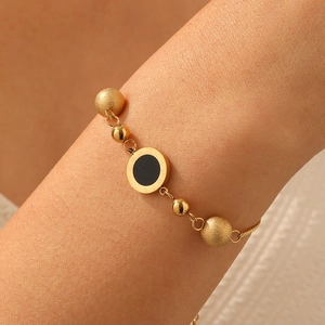 Gold Roman numeral disk bracelet with mixed texture beads and a sleek chain for women