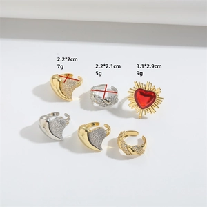 Minimalist open gold and silver rings set with heart motifs and sparkling gemstones