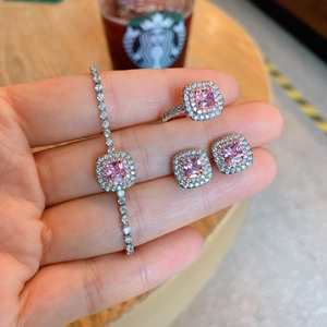 Detailed view of pink square zircon jewelry set with bracelet, ring and earrings