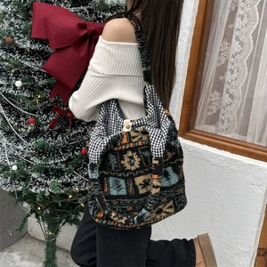 Detailed texture of ethnic plush tote bag with geometric patterns and holiday vibes
